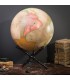 Pink globe on crossed wooden stand